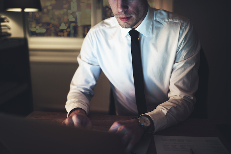 Lawyer working on redaction at his desk